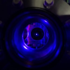 a blue glowing dot in the center of a chamber