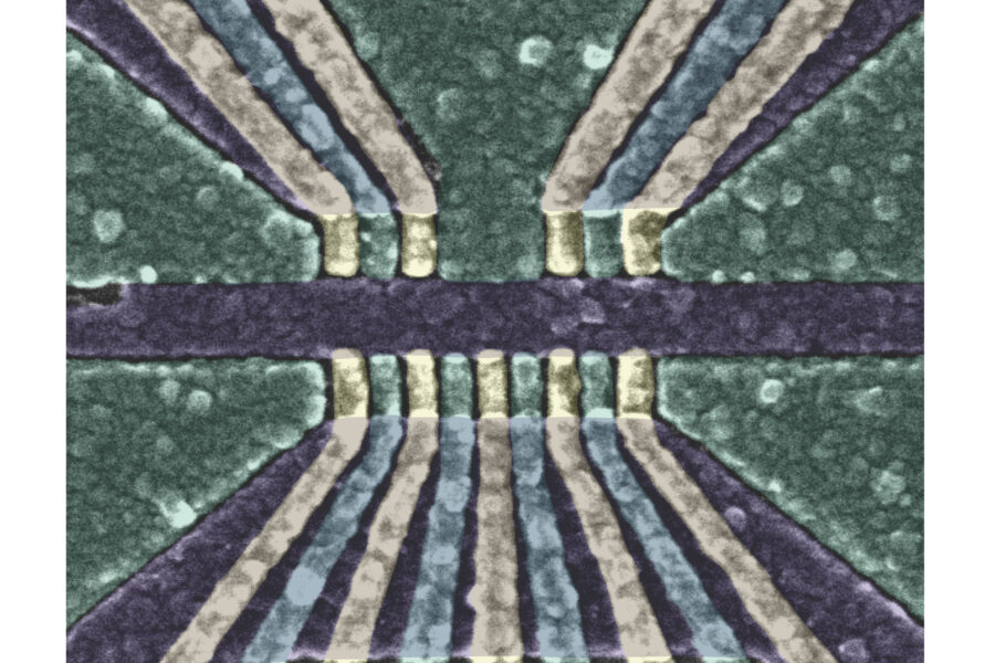 a geometric pattern of lines in green, light gold, and black/dark purple, representing the qubit