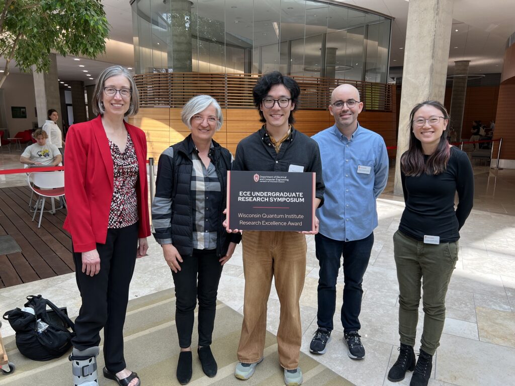 photo of Guizhong Luo with the award
